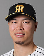 Teruaki Sato batting for Hanshin Tigers at Koshien Stadium in March 2024, archival photograph