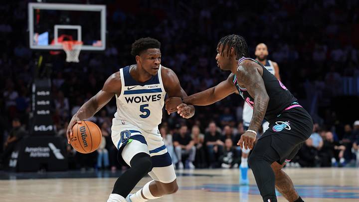 Anthony Edwards driving against the Miami Heat in a Minnesota Timberwolves jersey during a 2026 game