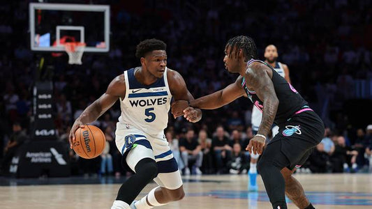 Anthony Edwards driving against the Miami Heat in a Minnesota Timberwolves jersey during a 2026 game