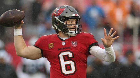 Baker Mayfield throwing a pass for the Tampa Bay Buccaneers as contract talks remain unresolved