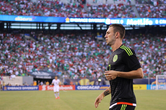 Miguel Layún on the football pitch in Mexico national-team colors during his playing career