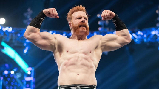 WWE wrestler Sheamus flexing his muscular upper body inside a wrestling arena
