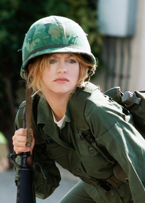 Goldie Hawn portraying Private Judy Benjamin in green Army fatigues and camouflage helmet