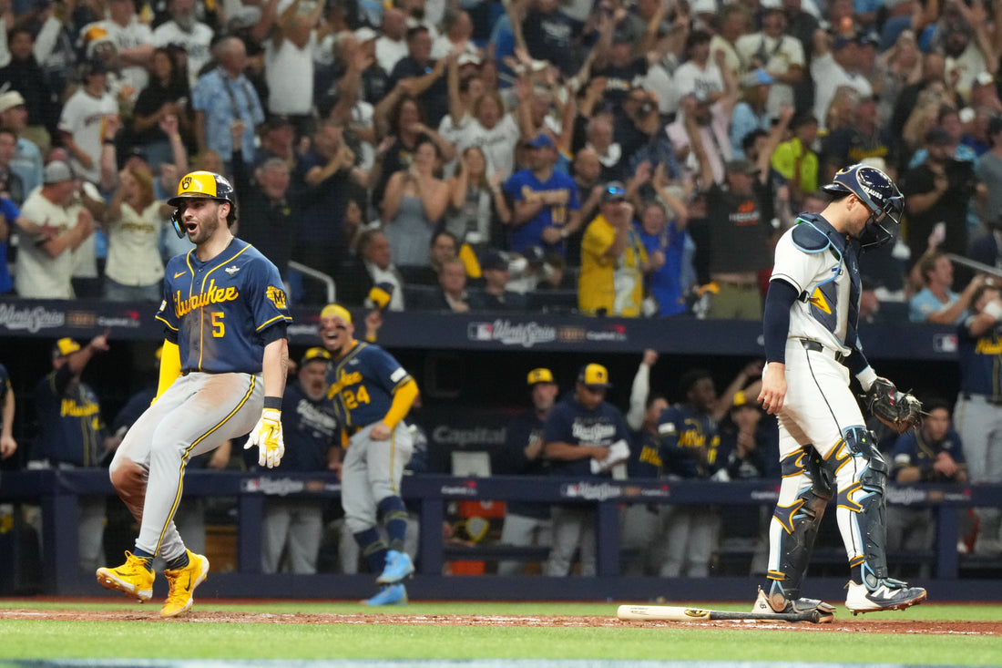 Garrett Mitchell celebrates scoring for the Milwaukee Brewers in World Series Game 3 against Tampa Bay