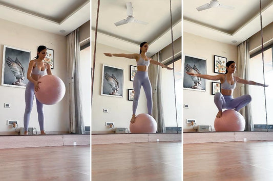Alaya F performing a weighted squat while balancing on a pink stability ball in a gym