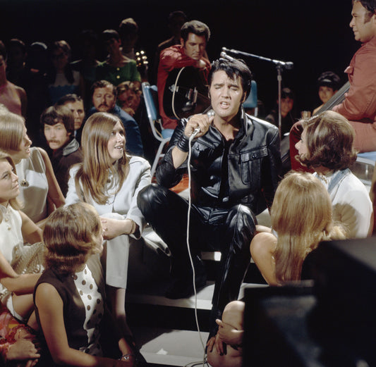 Elvis Presley performing in fitted black leather during the 1968 Comeback Special