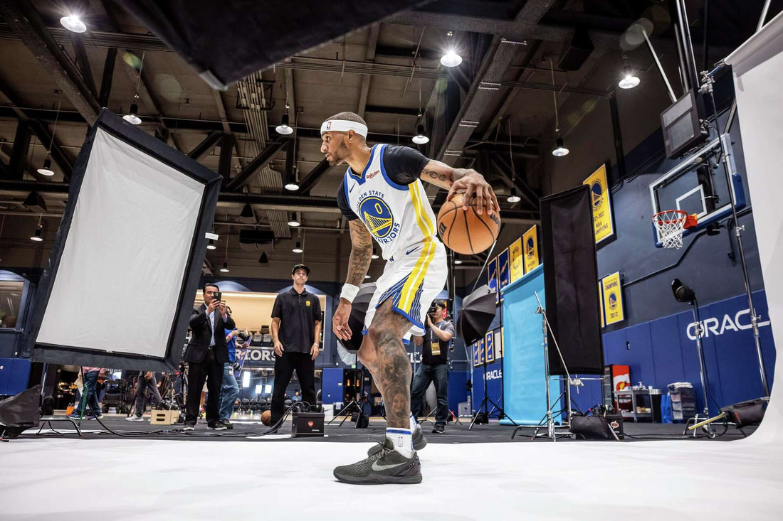 Gary Payton II of the Golden State Warriors dribbling a basketball during a media-day photo session