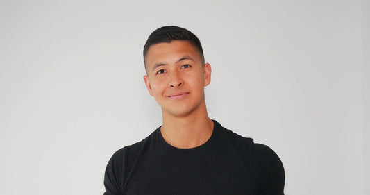 Portrait of Jeremy Ethier wearing a black T-shirt against a plain light background