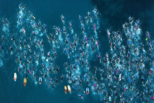 Aerial view of Ironman swimmers crossing Kailua Bay in Kona