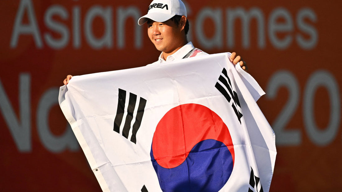 Tom Kim holding the South Korean flag after winning Asian Games golf gold
