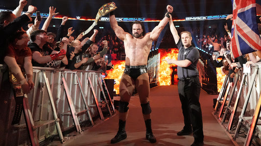 Drew McIntyre celebrating in the WWE arena, displaying his muscular physique and championship belt