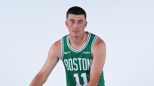 Payton Pritchard in green Boston Celtics uniform during 2025 media day