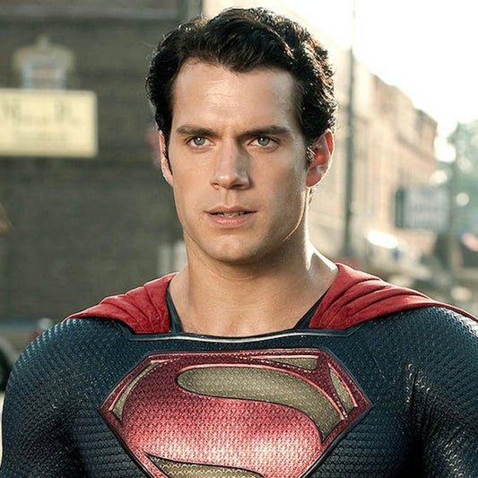 Henry Cavill as Superman in his blue suit with red cape and prominent chest shield