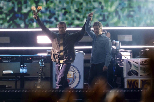 Liam and Noel Gallagher performing together during the Oasis reunion tour