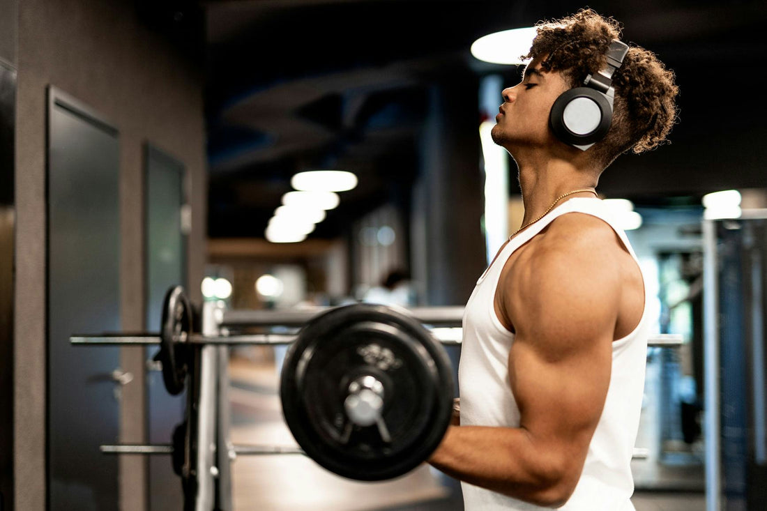 Lifter wearing headphones during a focused barbell workout