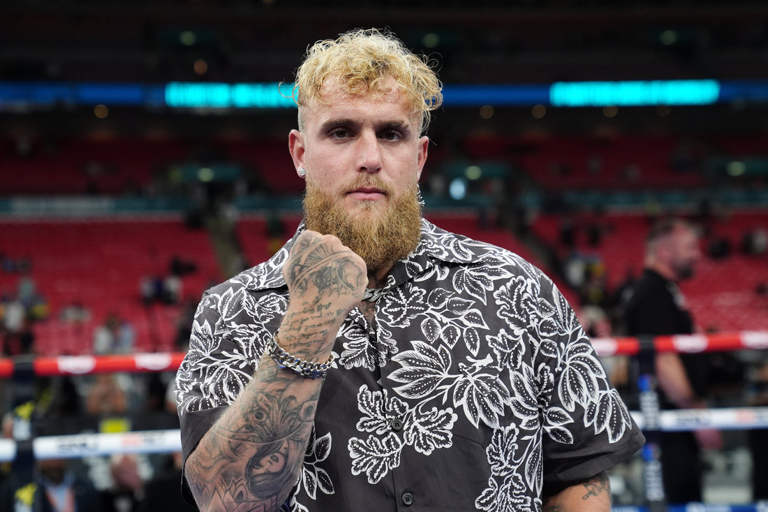 Jake Paul poses at a boxing venue before his comeback campaign