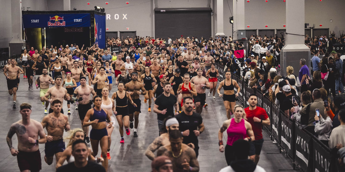 Large field of HYROX athletes starting a fitness race