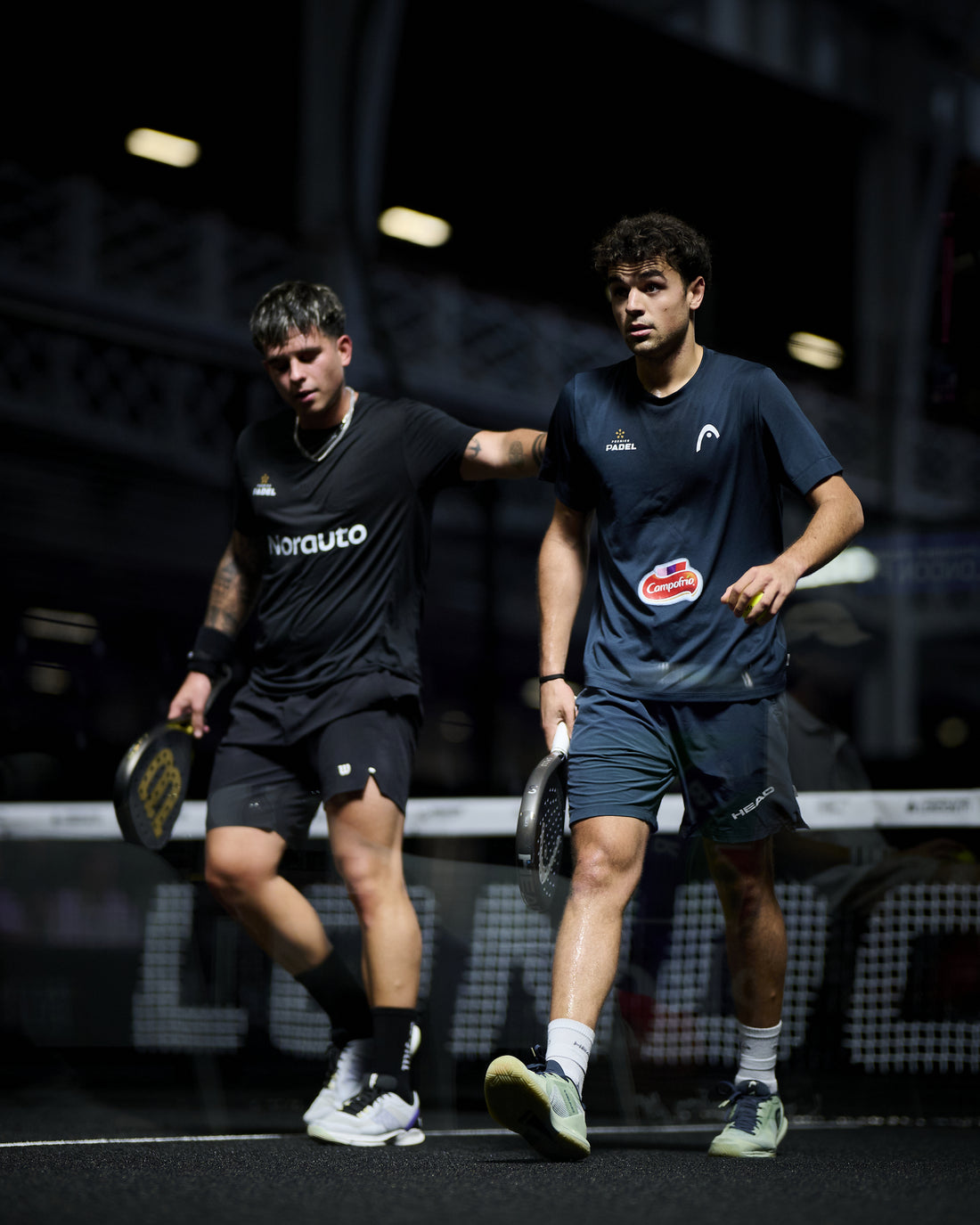 Javi Leal and Fran Guerrero walk off court together at the London Premier Padel P1 in August 2026