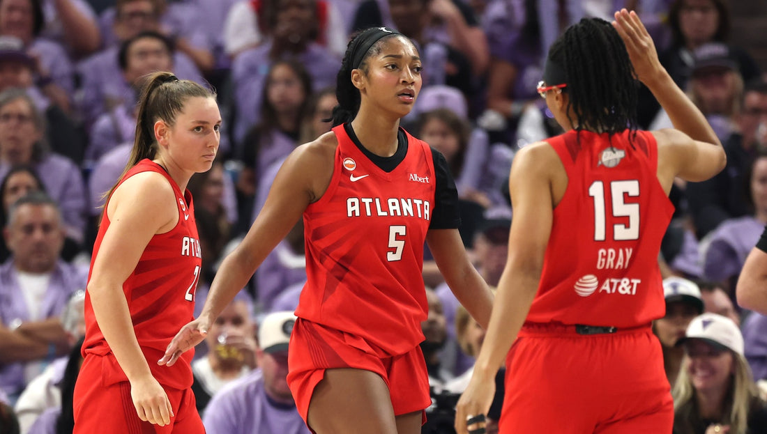 Isobel Borlase, Angel Reese and Allisha Gray in Atlanta Dream red during Game 2 of the 2026 WNBA Finals