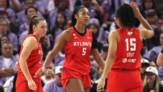 Isobel Borlase, Angel Reese and Allisha Gray in Atlanta Dream red during Game 2 of the 2026 WNBA Finals