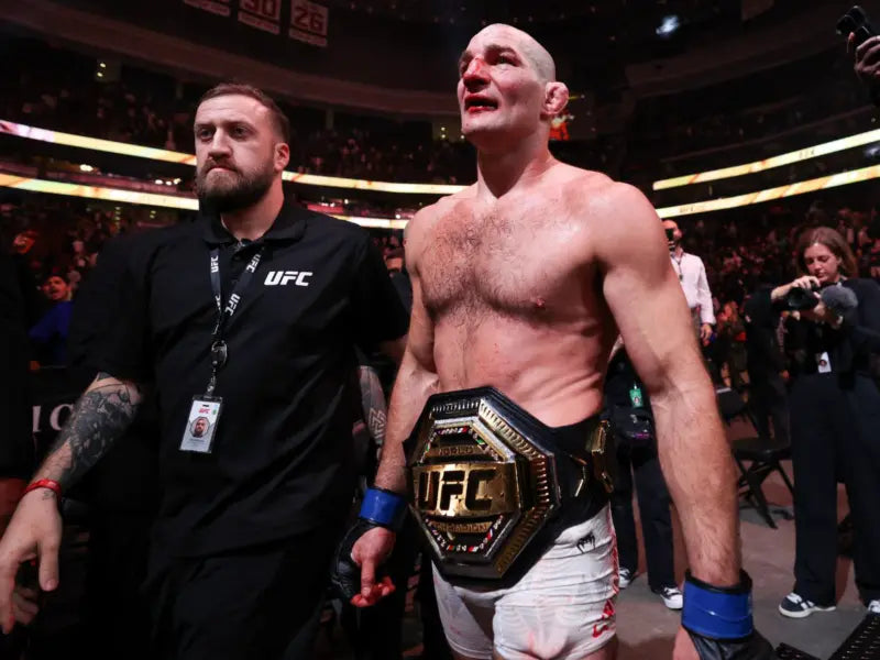 Sean Strickland with the UFC middleweight championship after UFC 328