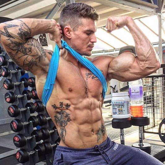 Ross Dickerson's muscular physique in a black-and-white fitness portrait