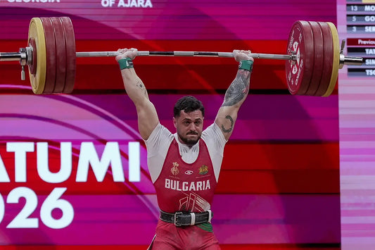 Karlos Nasar lifting a loaded barbell overhead at the 2026 European Championships in Batumi