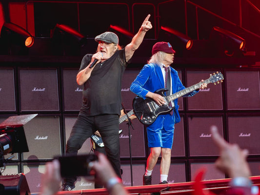 AC/DC's Angus Young and Brian Johnson performing together on stage