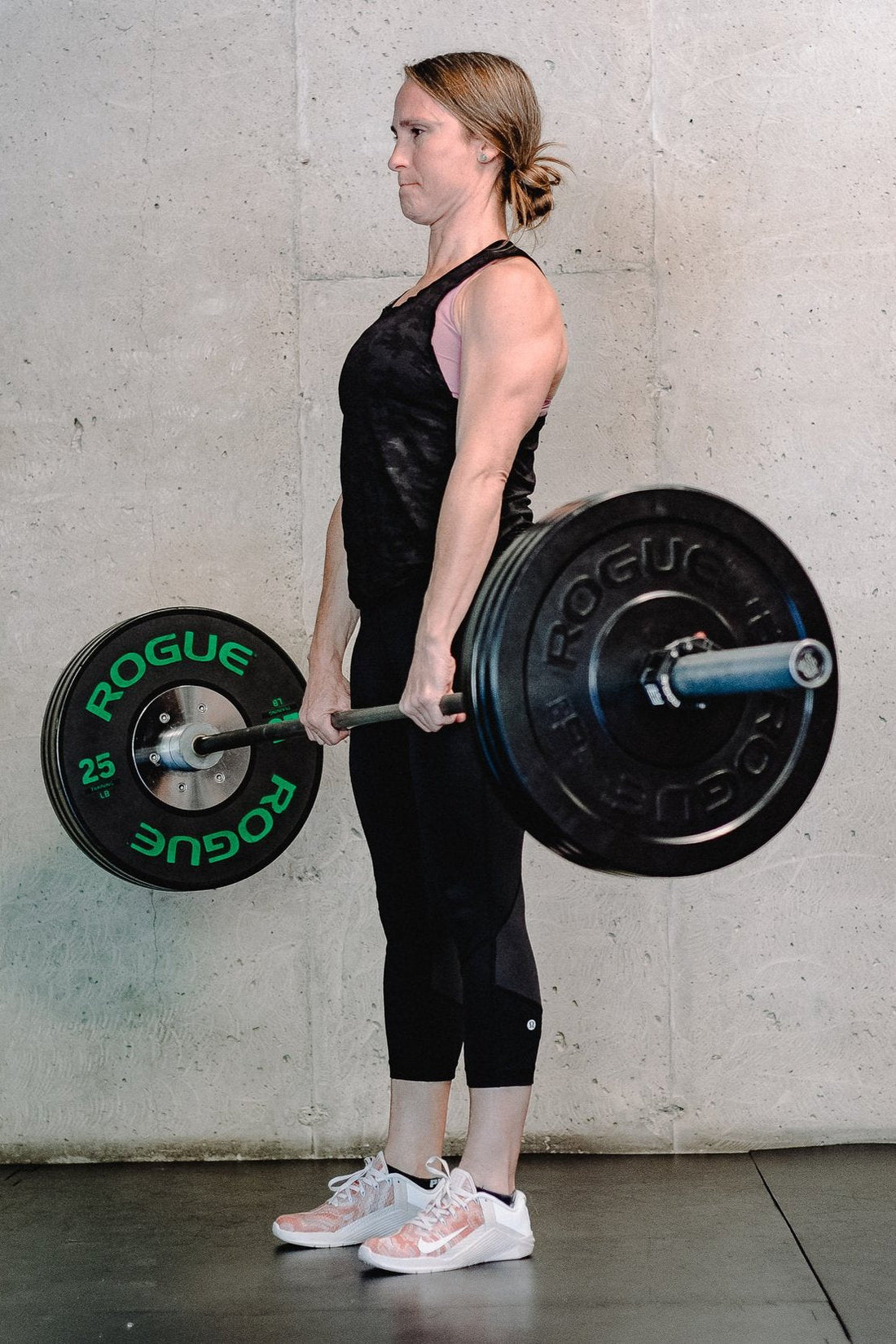 Side-by-side comparison of a kettlebell swing and barbell deadlift