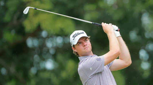Austin Hitt follows through on a golf shot in an archival Titleist photograph