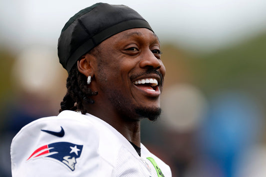 A.J. Brown stretches during New England Patriots practice on October 14, 2026