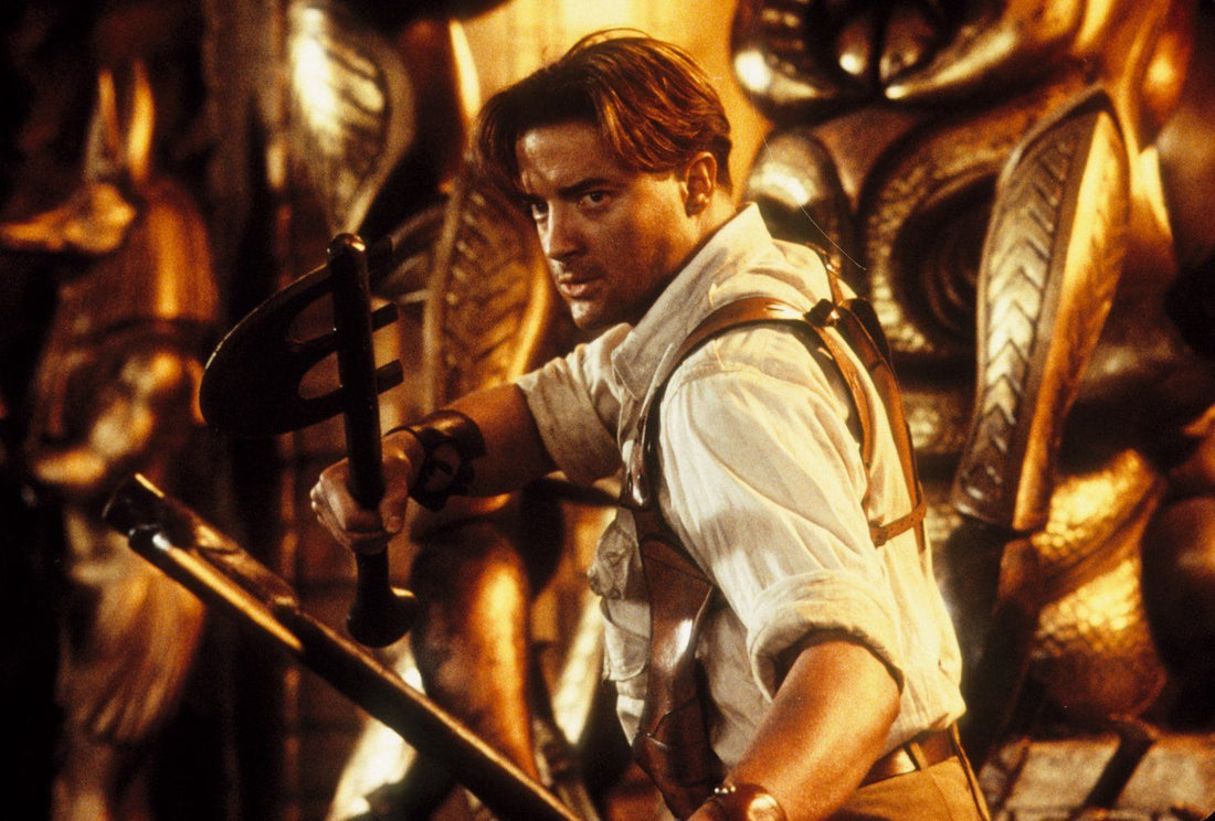 Brendan Fraser as Rick O'Connell holding a weapon inside an Egyptian tomb in The Mummy