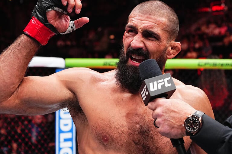 Court McGee speaking in the Octagon during the late stage of his UFC career