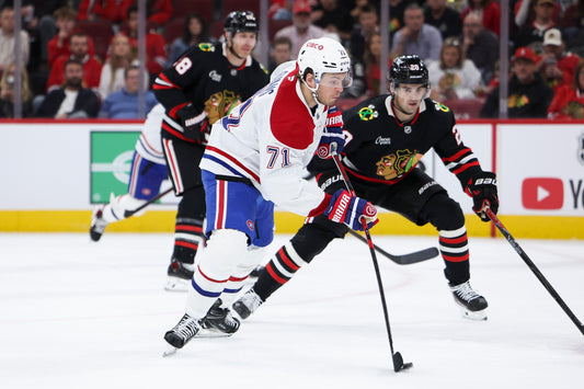 Jake Evans of the Montreal Canadiens skates with the puck against Chicago on October 23, 2026