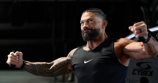 Roman Reigns training in a gym while preparing his body for athletic performance