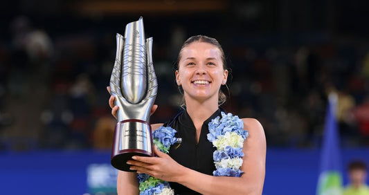 Maja Chwalinska holds the 2026 Wuhan Open trophy after winning her first WTA title