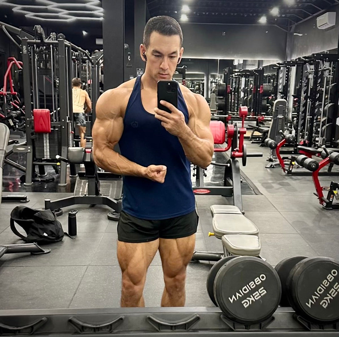 Sean Nalewanyj standing in a gym after strength training, illustrating reps in reserve and controlled lifting effort