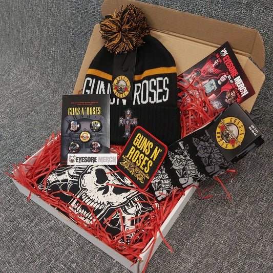 Gift box containing Guns N' Roses-themed black beanie, graphic tee, patches, buttons and rock accessories