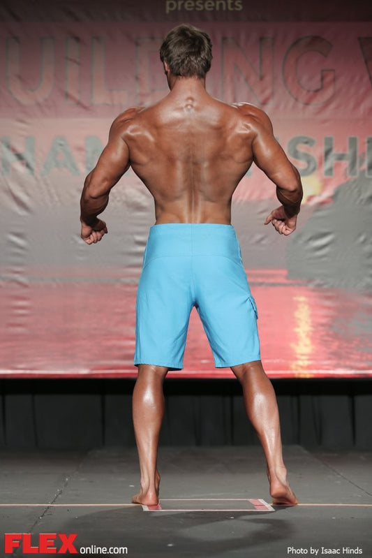 Jeff Seid presenting his developed shoulders and back on a bodybuilding stage
