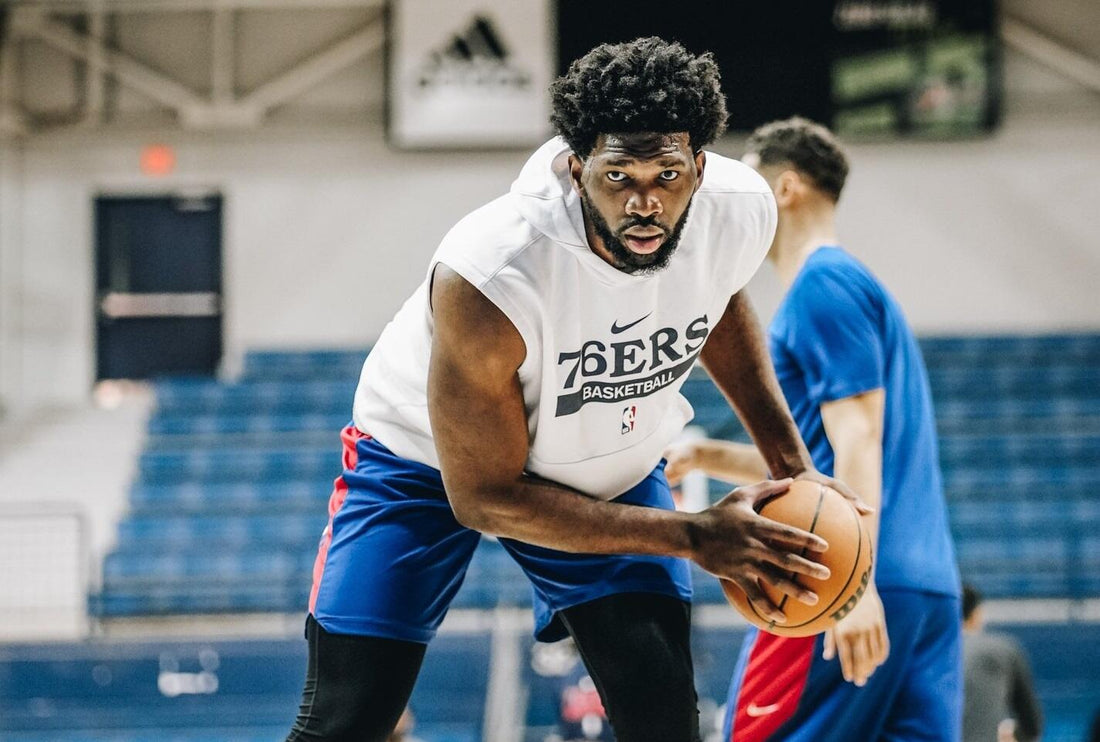 Joel Embiid strength training in a gym, illustrating his shift toward heavier resistance work