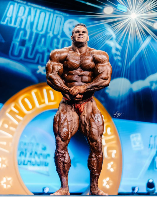 Nick Walker posing on the Arnold Classic stage in his championship campaign
