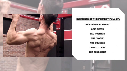 Jeff Cavaliere demonstrating a pull-up on an overhead bar in a gym