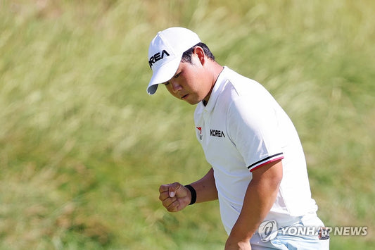 Tom Kim celebrates in South Korea colors during the 2026 Asian Games golf tournament