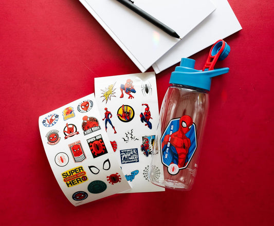 Spider-Man sports bottle beside sheets of red-and-blue superhero stickers