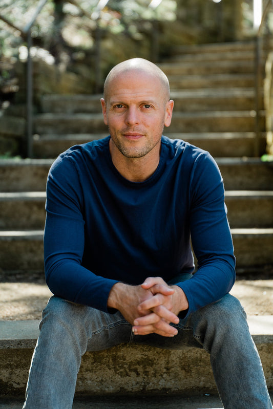 Tim Ferriss portrait outdoors, illustrating a guide to his mobility and training philosophy