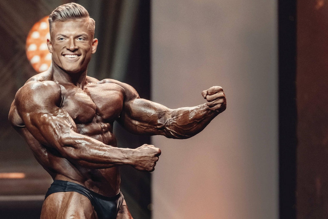 Urs Kalecinski displaying his Classic Physique onstage