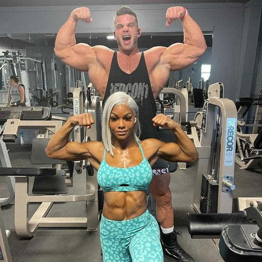 Jade Cargill and bodybuilder Brian Cage flex their arms in a gym