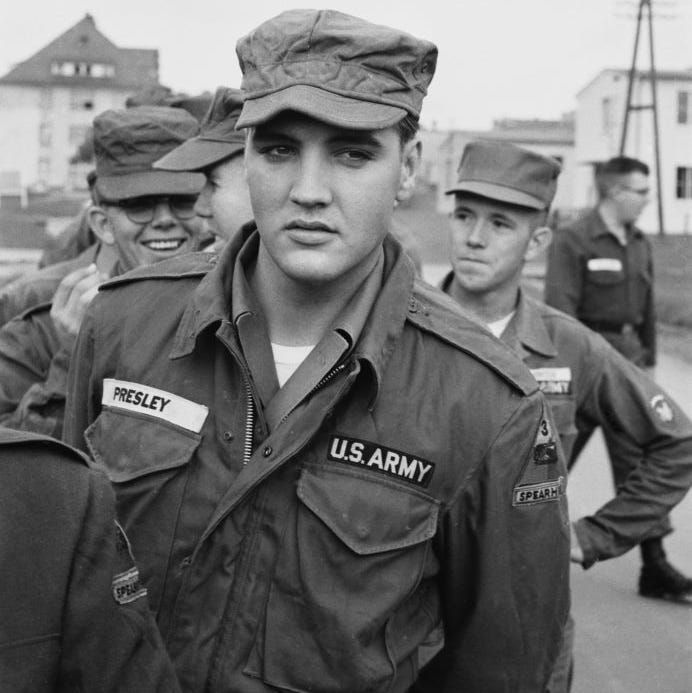 Elvis Presley in Army fatigues among fellow soldiers