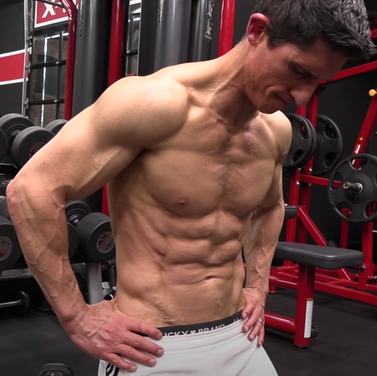 Jeff Cavaliere displaying a lean muscular physique in the ATHLEAN-X gym