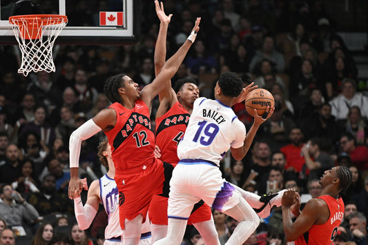Scottie Barnes and Collin Murray-Boyles defend together for Toronto in February 2026